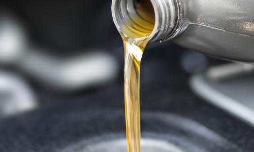 Oil being poured into an engine