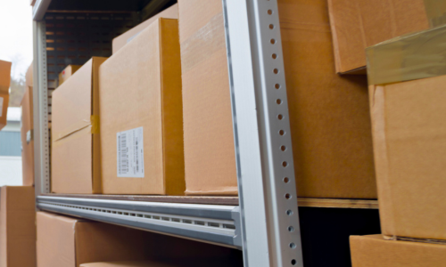 Boxes stacked on a metal rack