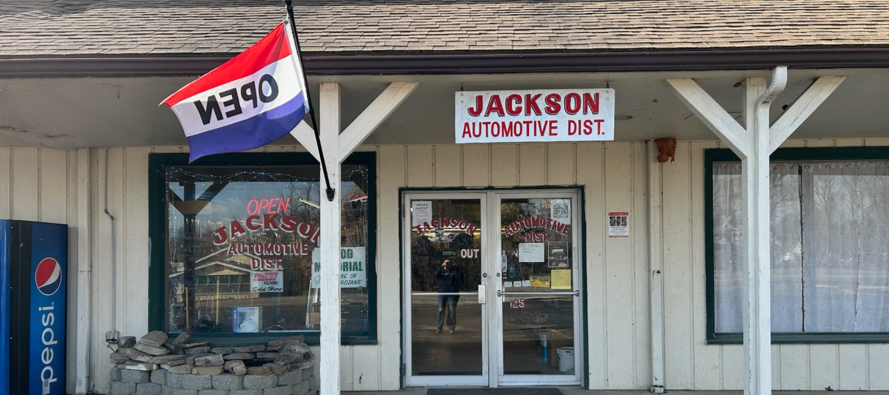 Jackson Automotive Distributors store front on a clear day.
